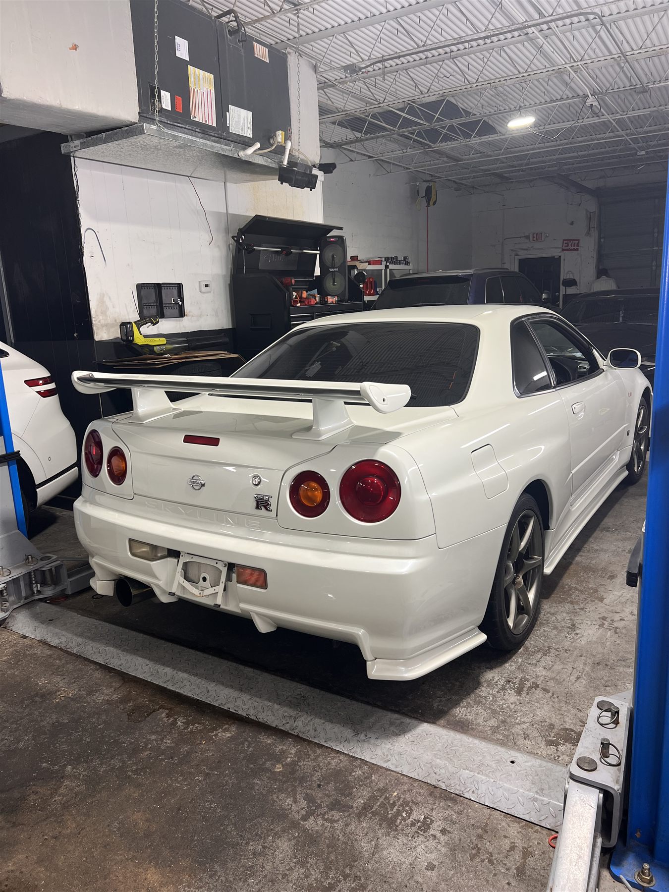 White Nissan Skyline GT-R in the repair shop
