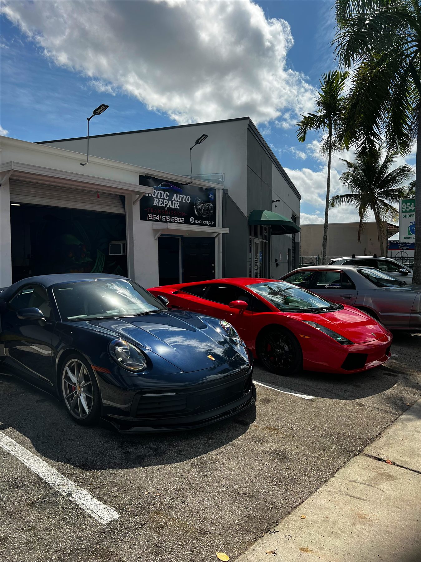Porsche and Lamborghini parked at Exotic Auto Repair And Transmission