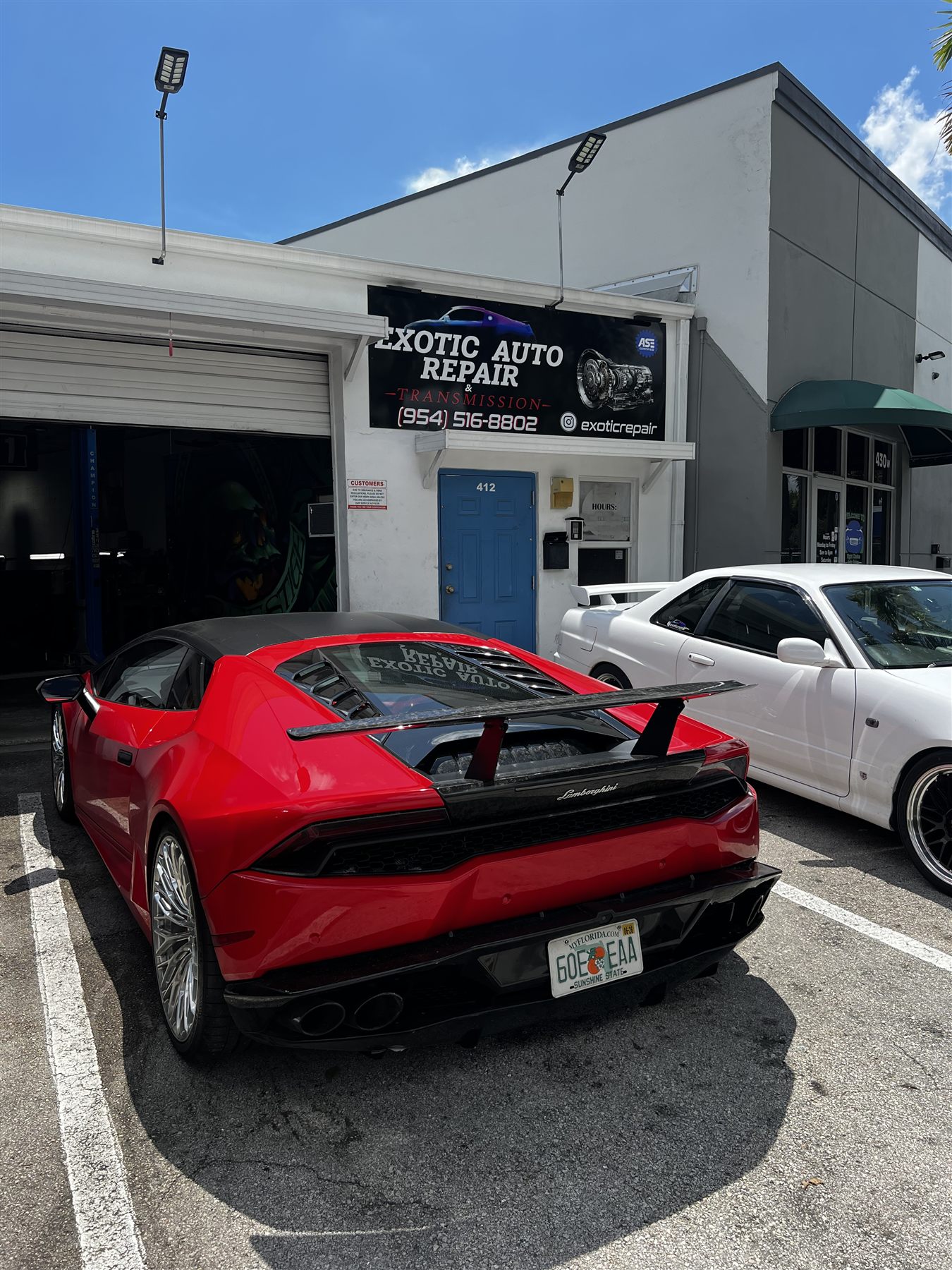 White BMW performance car being serviced