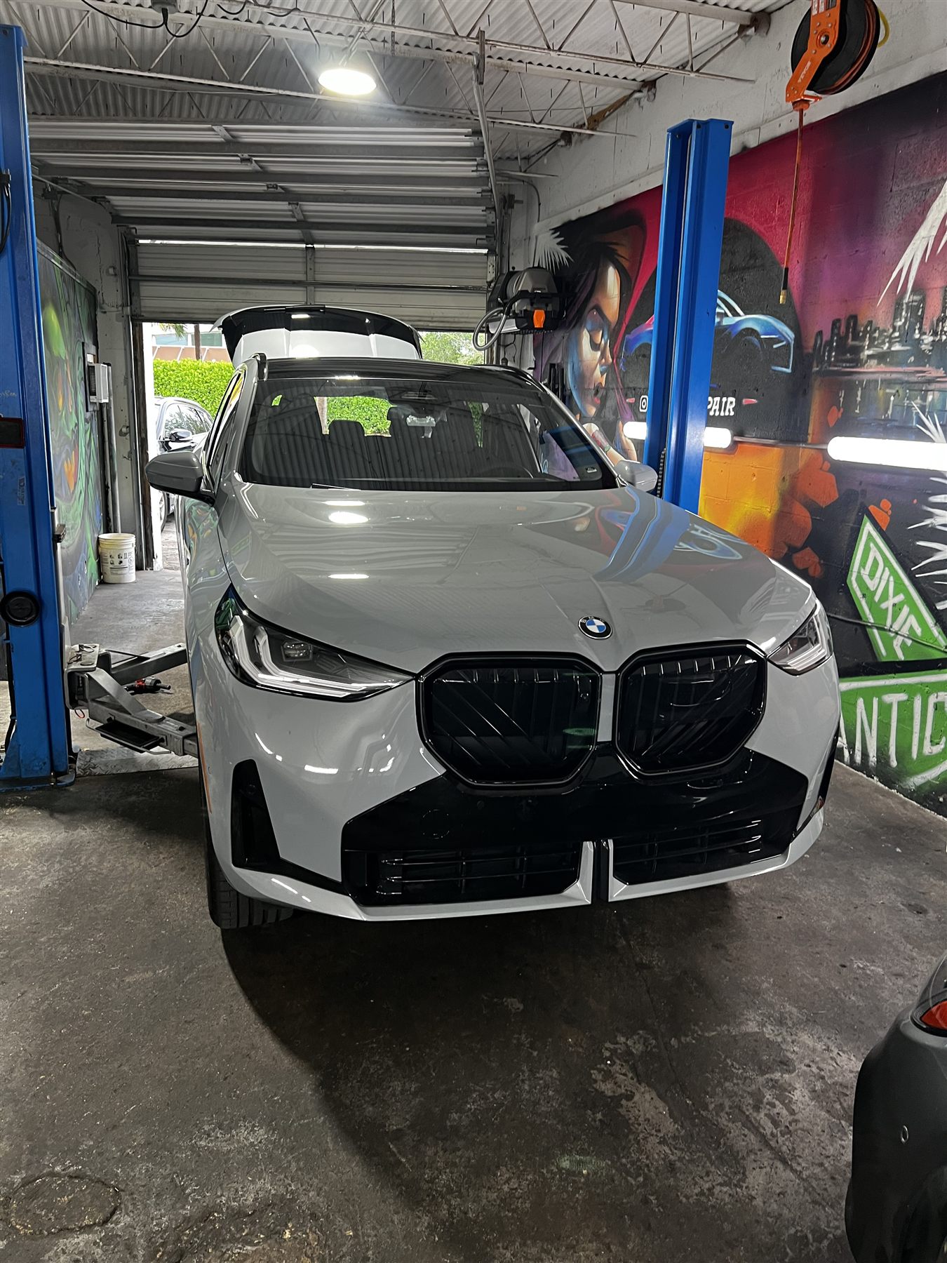 White BMW coupe parked outdoors