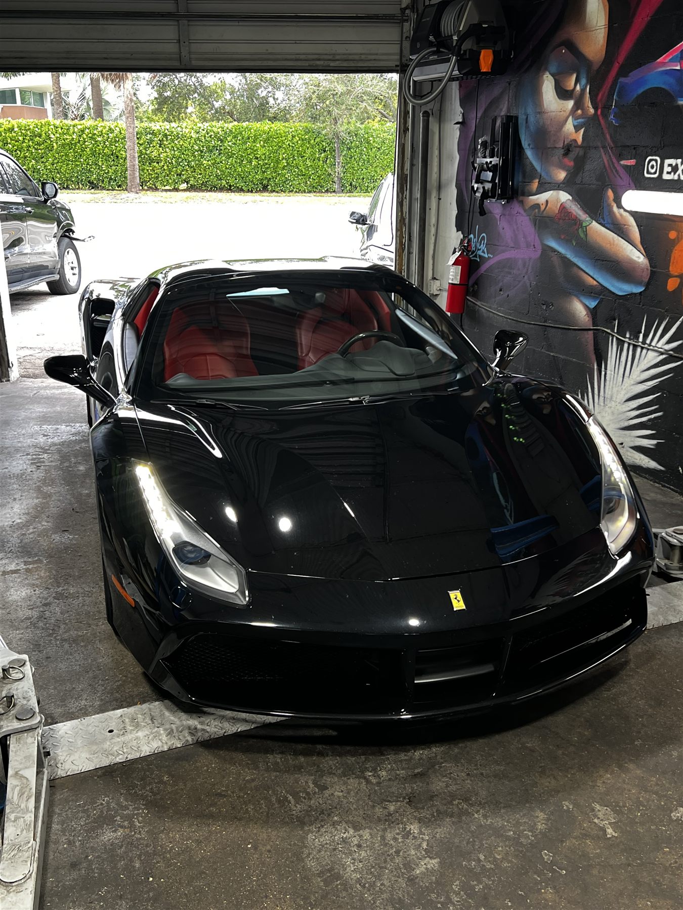 Red Lamborghini parked outside Exotic Auto Repair And Transmission